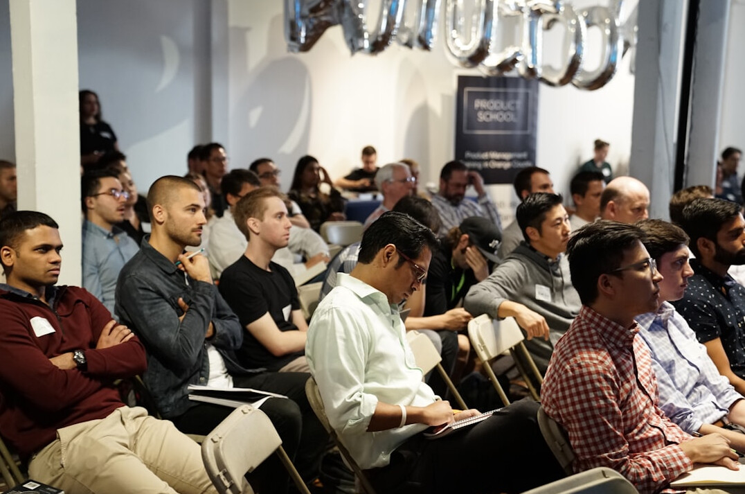 audience listening to speaker