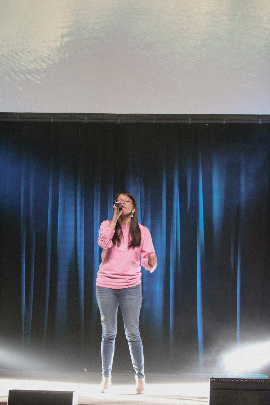 confident speaker on stage