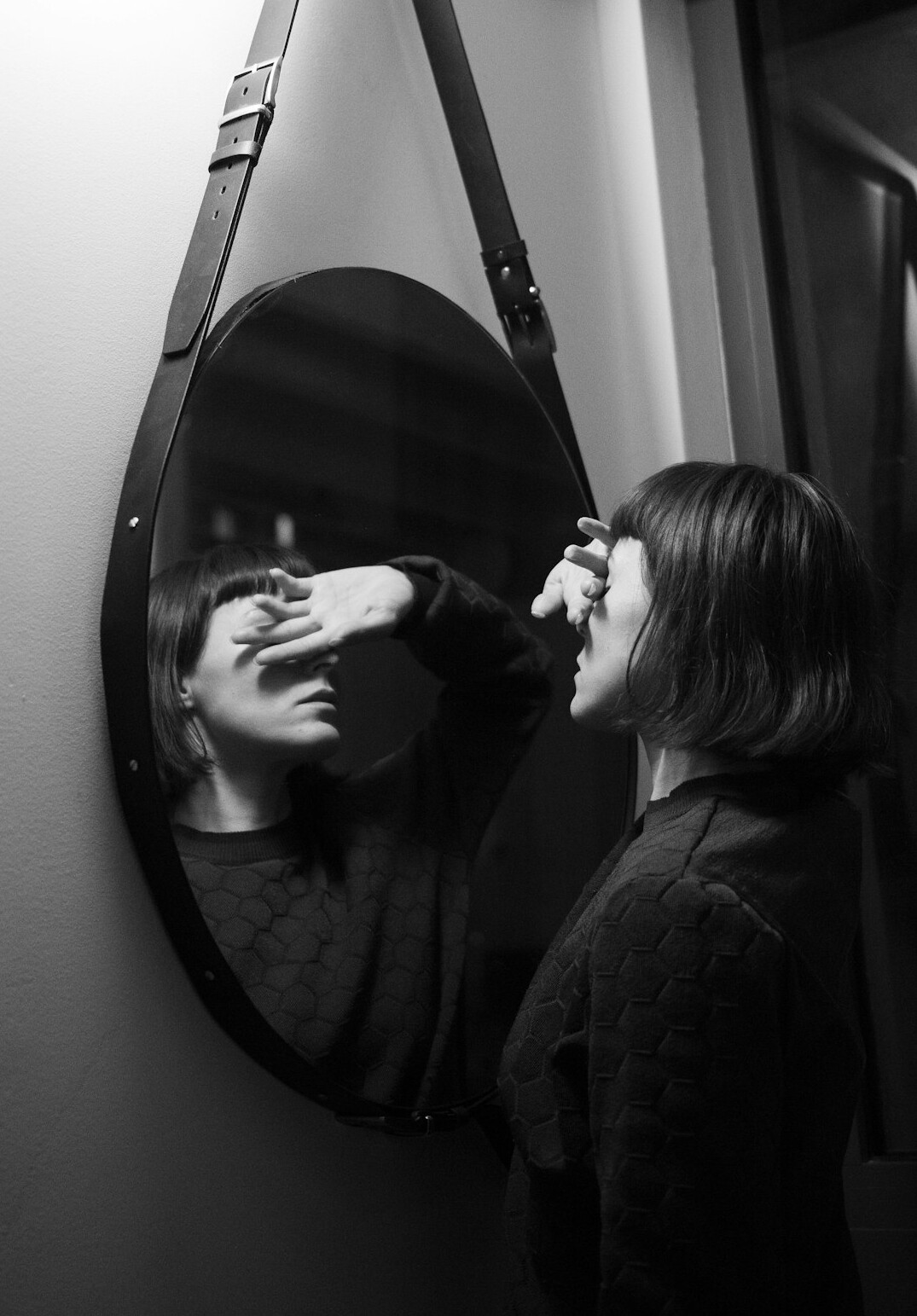 person reflecting in mirror