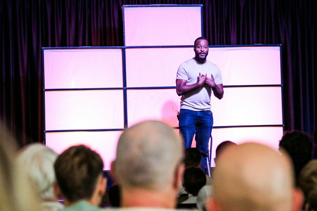 confident speaker on stage