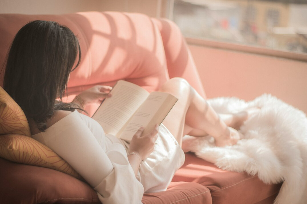 person reading self help book