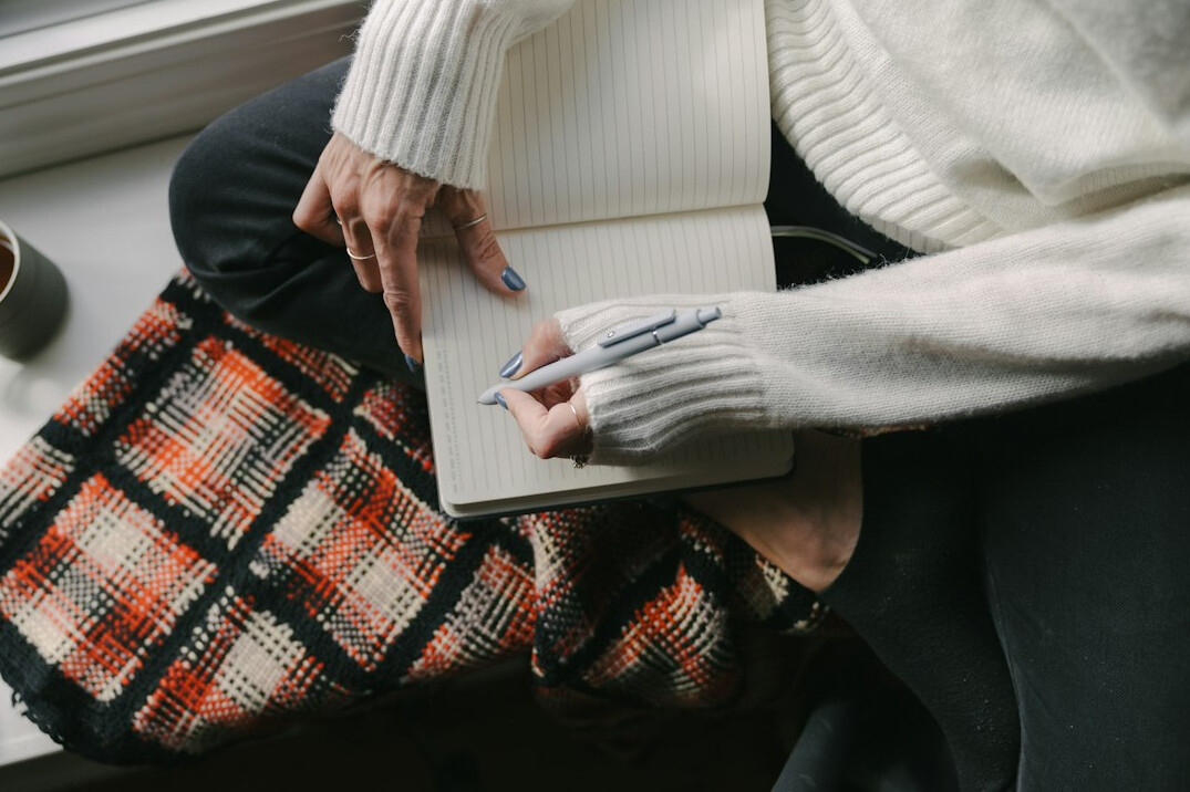 person journaling at home